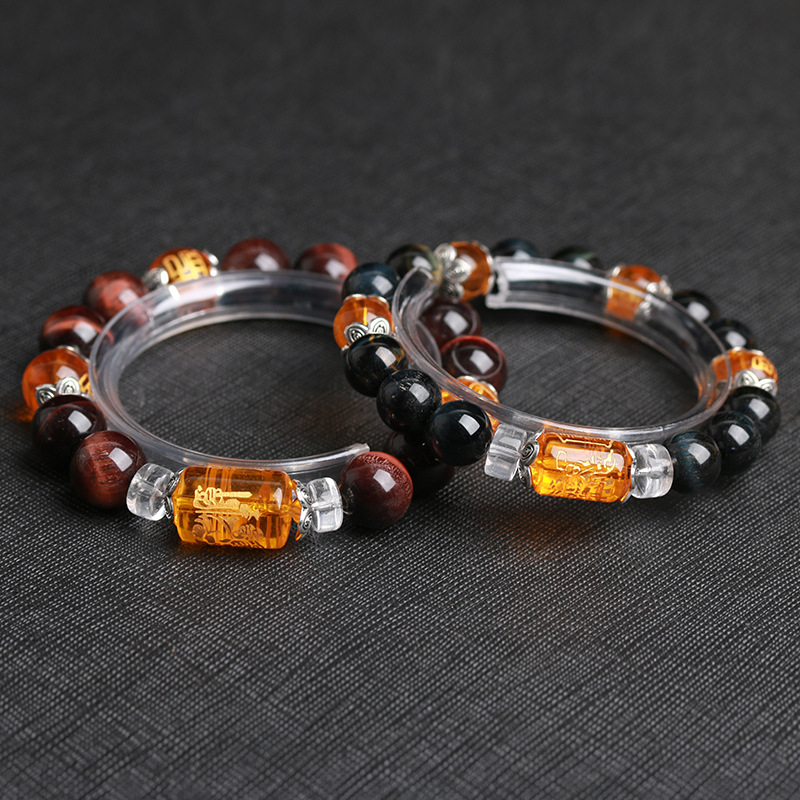 PULSERA DE OJO DE TIGRE CON GRABADO DORADO Y DETALLES EN ACERO