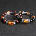 PULSERA DE OJO DE TIGRE CON GRABADO DORADO Y DETALLES EN ACERO